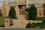 Arizona Flagstone - Classic Oak for Front Walk and  Landscape Walls. House Walls and Pilaster are  Matching Ledgstone with Combined with Stucoo  on House.