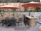 Cultured Stone Veneer on Walls withStand Out  Pieces for Candles and Accents.  Pre-Cast  Concrete Cap and Tile Cpunter with Stamped  Concrete Patio with Seamless Skin