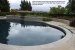 Light Sand Wash Finish Patio with Square Nosed Pre-Cast Concrete Coping and Tile Pool Wall Cap. Poured in Place Concrete Seatwall